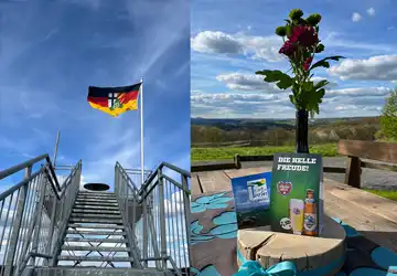 Treppe hoch zur Aussichtsplattform mit deutscher Fahne. Die Tischdekoration lädt zum Verweilen ein.